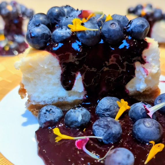 blueberry compote on cheesecake slice