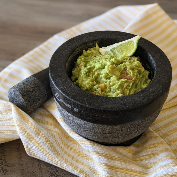 A stone bowl with fresh guacamole