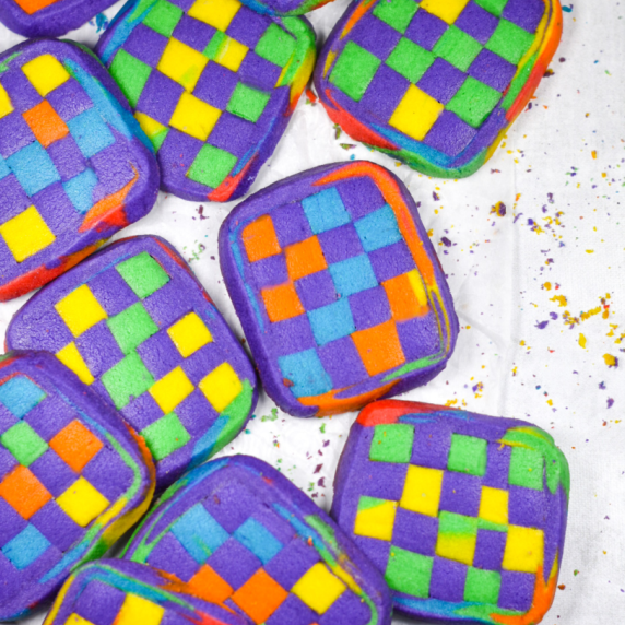 rainbow checkerboard cookies on a white surface