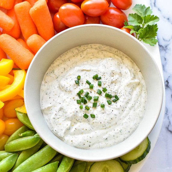 greek yogurt ranch dip in a bowl on a veggie platter.