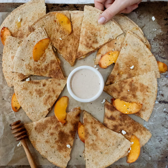 Peach and goat cheese quesadilla on baking pan