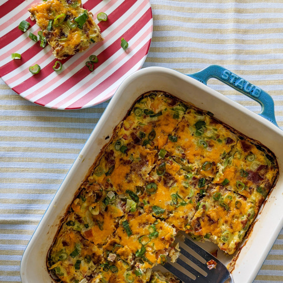 An egg casserole with veggies and bacon