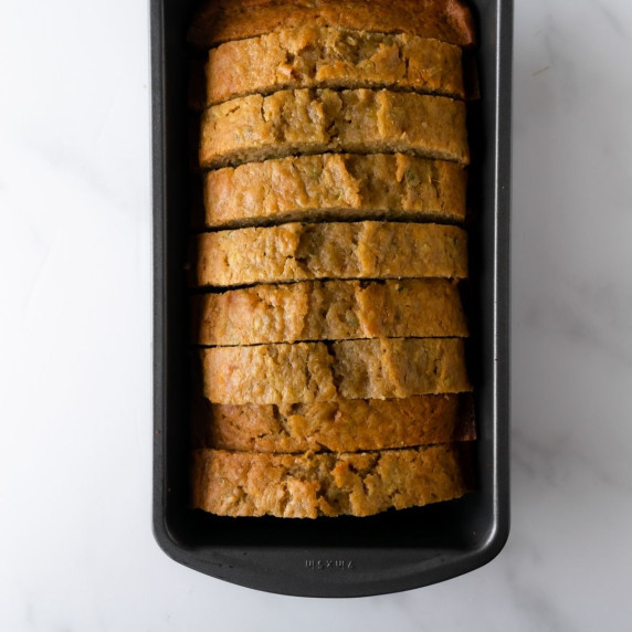 sliced zucchini bread in a bread pan.