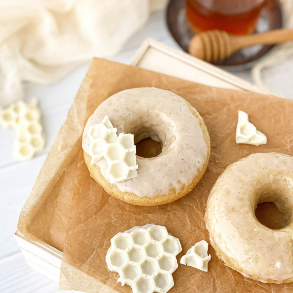 Honey Doughnuts on parchment paper with white chocolate 