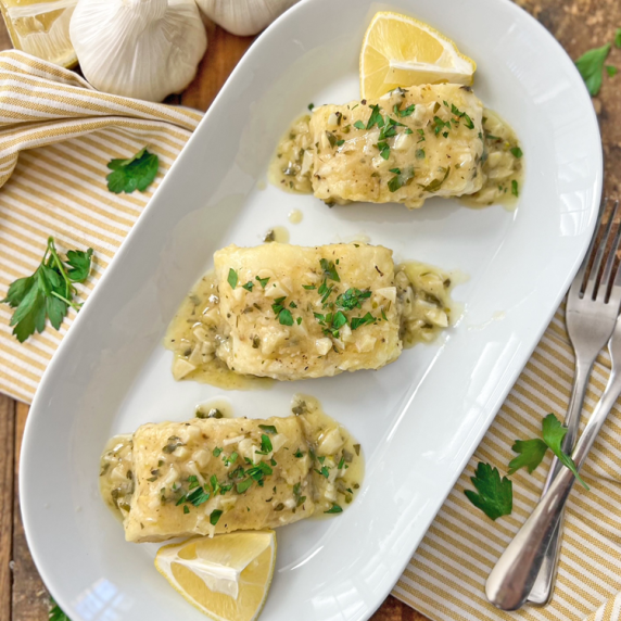 Fish with CREAMY Lemon-Garlic Sauce