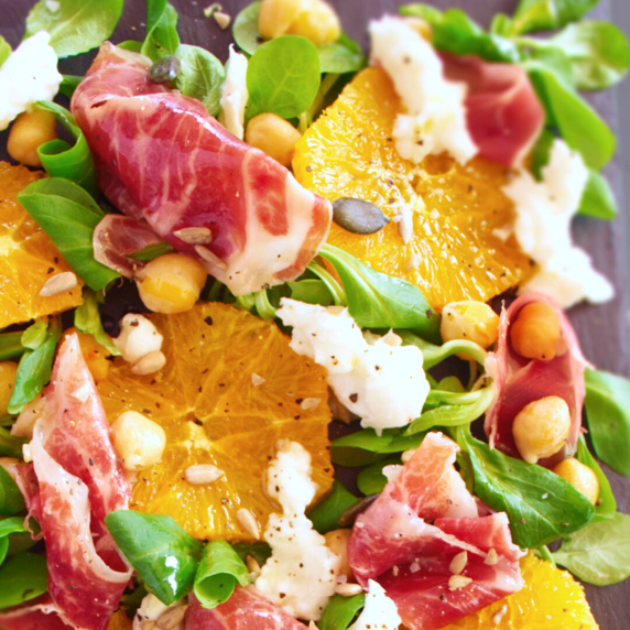 a late of Jamón Ibérico salad with orange, chickpeas, and almonds