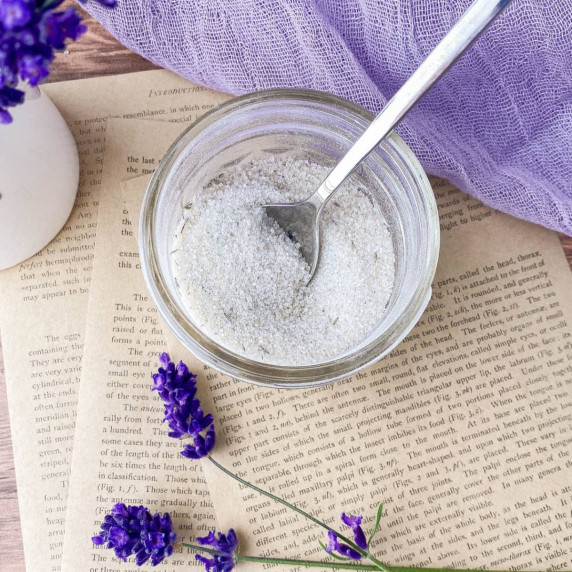 Jar of Lavender Sugar with fresh lavender flowers nearby.