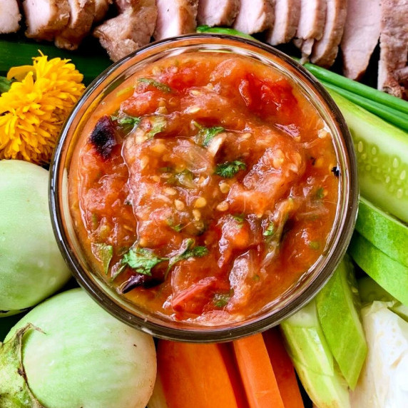 Jeow mak len, Lao tomato dipping sauce, with grilled pork, fresh vegetables, and more.