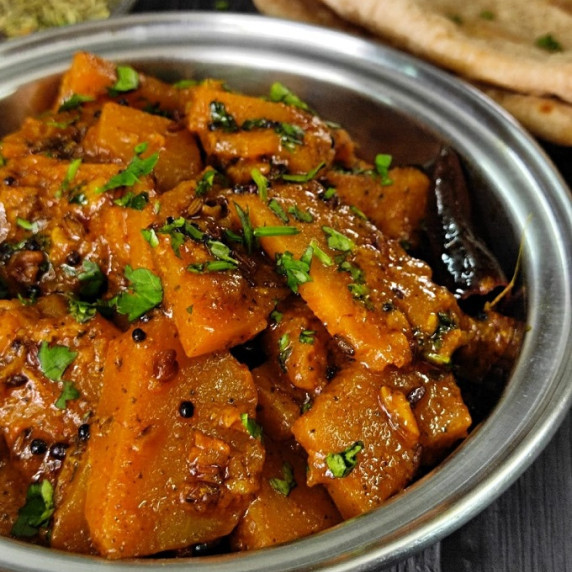 A delicious sweet & sour pumpkin curry made with basic ingredients. A perfect meal.