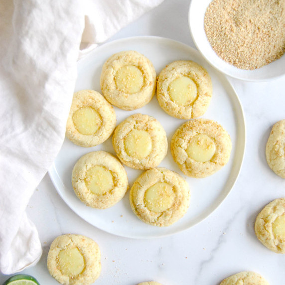 key lime pie cookies on white plate and marble background