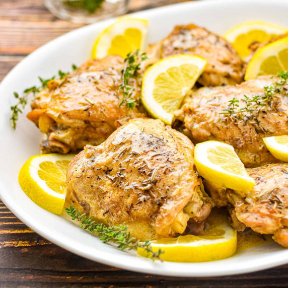 lemon chicken thighs on a platter.