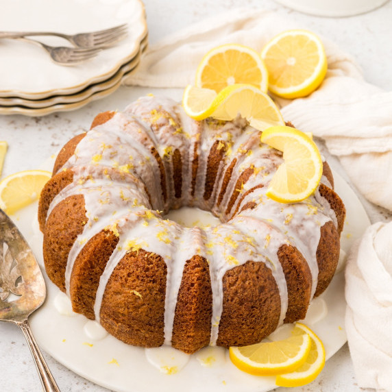 Lemon Bundt Cake with glaze and lemon slices.