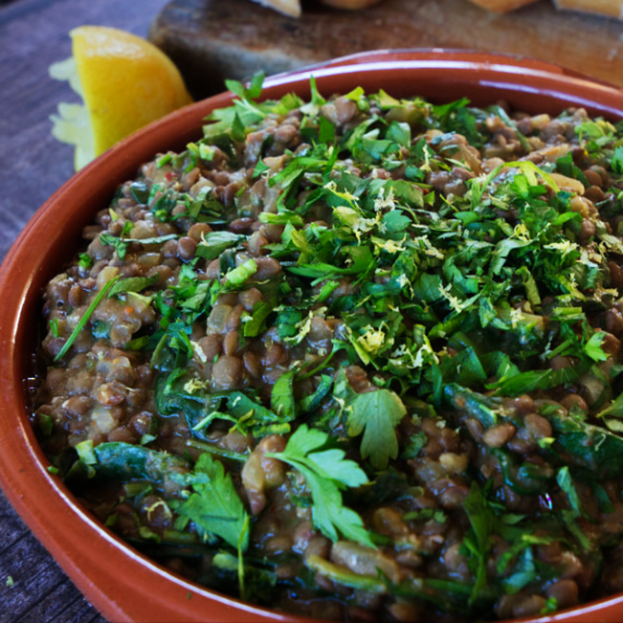 a bowl of lentil and spinach stew