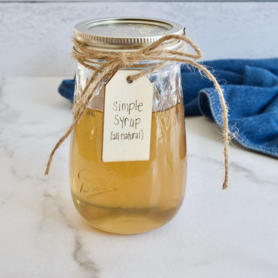 A pretty jar of golden liquid, filled with simple syrup made with all natural cane sugar. 