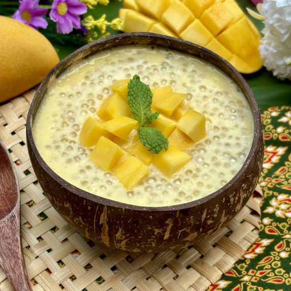 Mango sago served in a coconut shell.