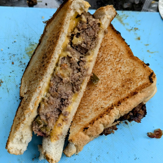 A meatloaf sandwich cut in half.