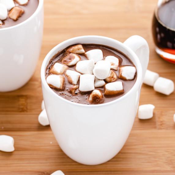 Microwave hot cocoa in a white mug with marshmallows.