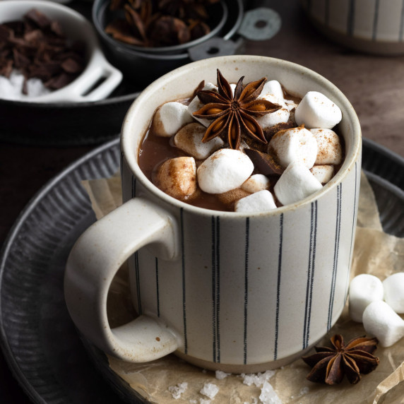 Oat milk hot chocolate in a mug with marshmallow toppings