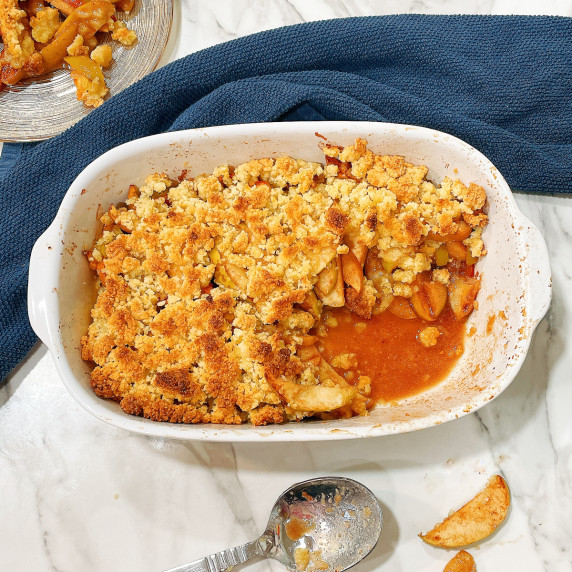 easy gluten free apple crisp in a dish with a scoop removed