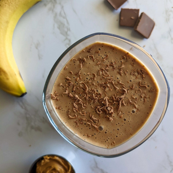 A chocolate protein shake made with peanut butter and banana