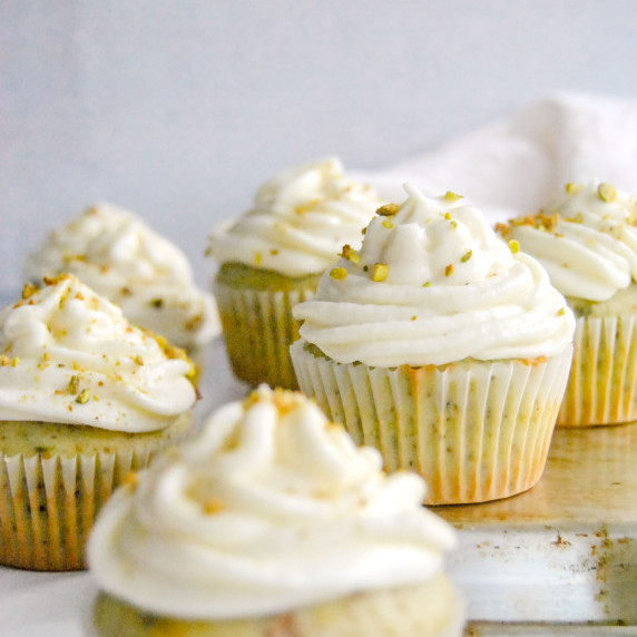 pistachio orange cupcakes with grey background