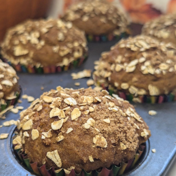 pumpkin muffins in a muffin pan. 