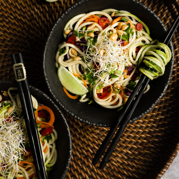 Pad Thai with Zucchini Noodles arranged in an aesthetic plates with chopsticks