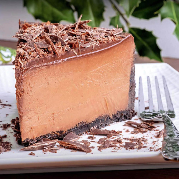 A slice of Chocolate Mousse Cheesecake with Gloss Ganache
