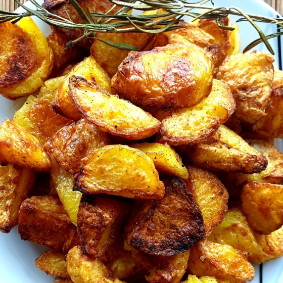 Roasted Potatoes on a plate with a rosmarin