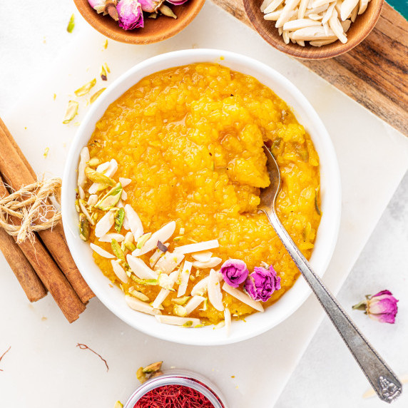 a bowl of Sholeh Zard, Persian Saffron Rice Pudding