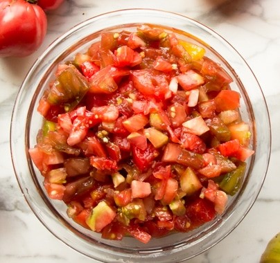 When the tomatoes ripen, it’s time to make garden tomato salsa. This recipe checks all the boxes for