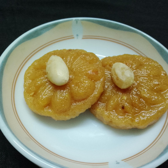 two almond barfi on a plate