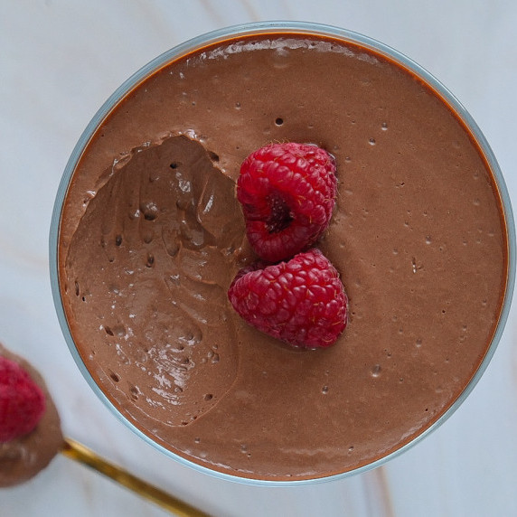 Silken tofu chocolate mousse served with two raspberries