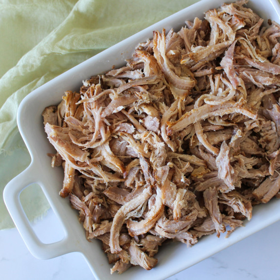 A dish of hand-pulled slow cooker carnitas (pork)