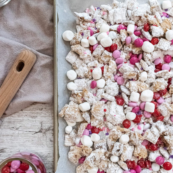 Baking sheet of pink and white puppy chow