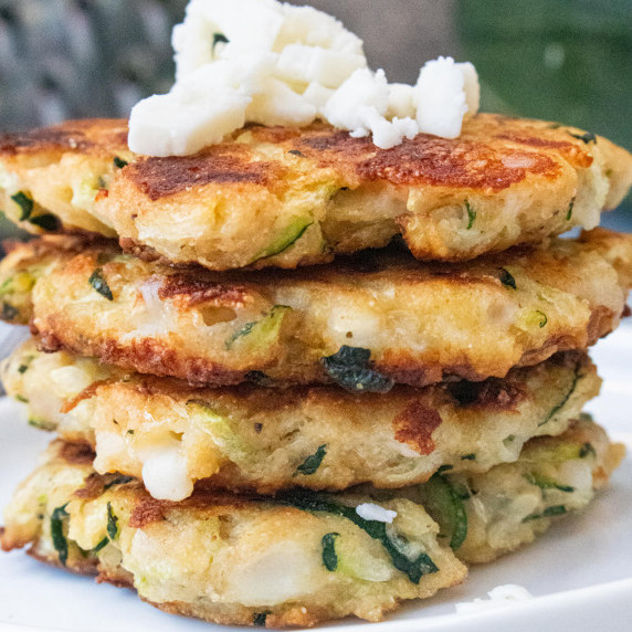 zucchini fritters stacked with mozzarella cheese