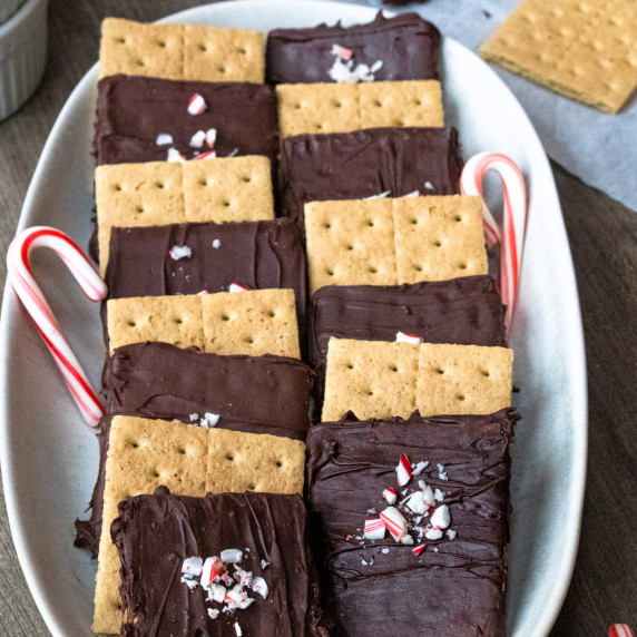 chocolate covered graham cracker with candy canes