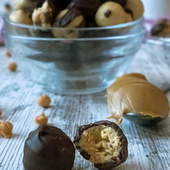 peanut butter chocolate buckeyes on white table