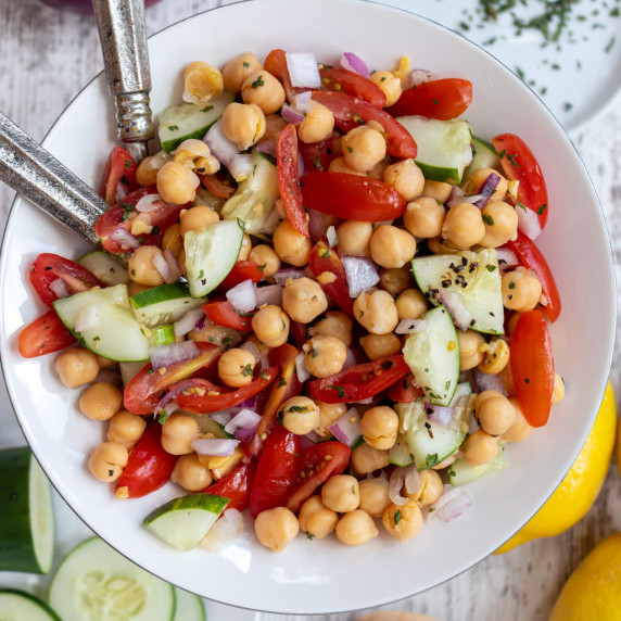 chickpeas and veggies in a white bowl