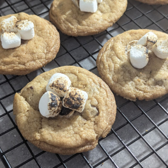 Marshmallow topped s'mores cookies on a cooling rack.