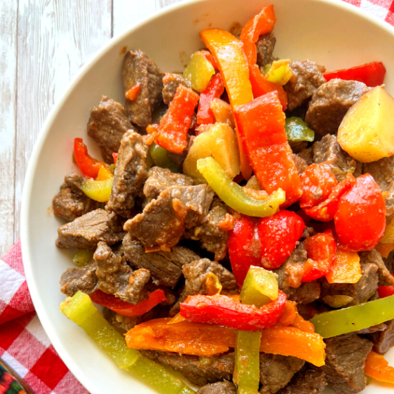 steak with bell peppers on plate