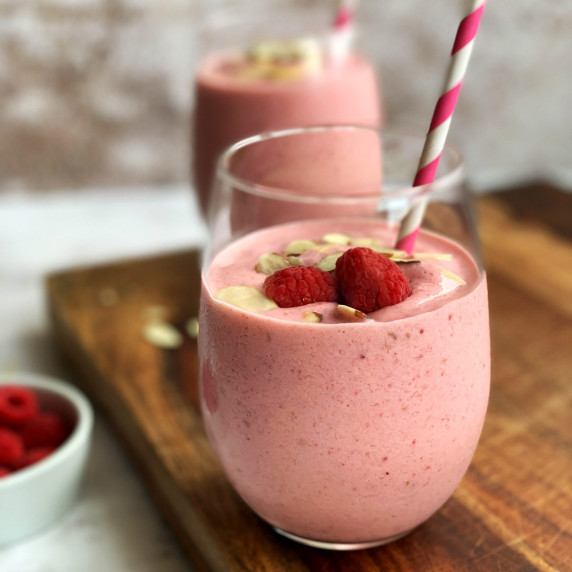 Strawberry banana raspberry smoothie in a glass
