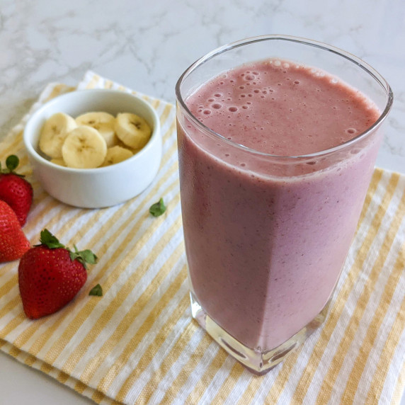 A strawberry banana smoothie in a glass