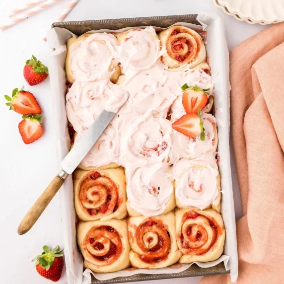 strawberry cinnamon rolls, partially frosted