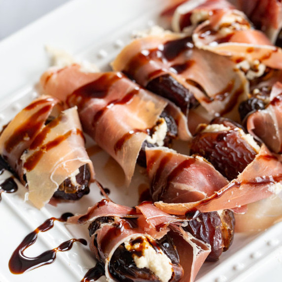 Wrapped dates with a cashew cream and a balsamic glazze