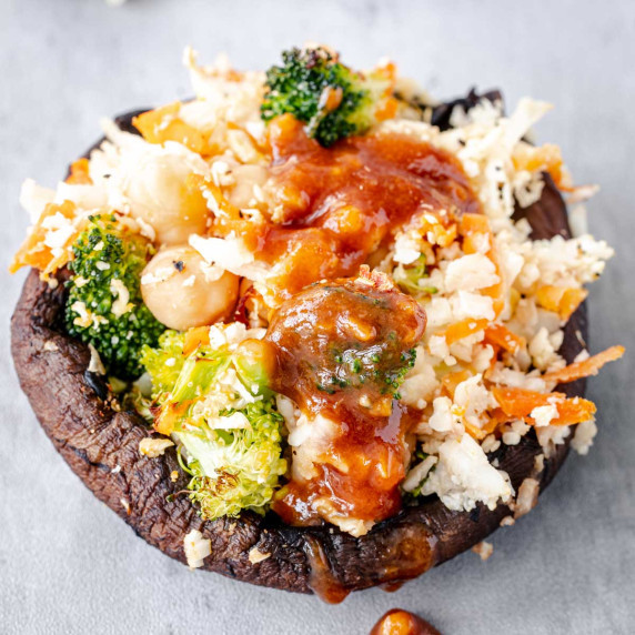 Stuffed portobello mushroom with cauliflower rice filling topped with spicy tamari sauce.