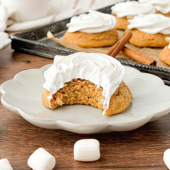 Sweet Potato Cookie topped with marshmallow frosting with a bite missing.