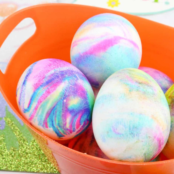 Close up of Easter Eggs swirled with color in a basket.