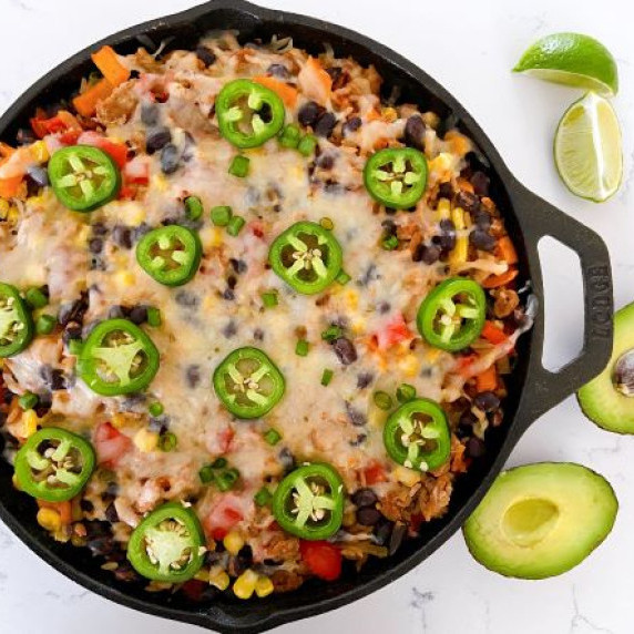 Turkey and black bean taco skillet with cheese and jalapenos in a skillet