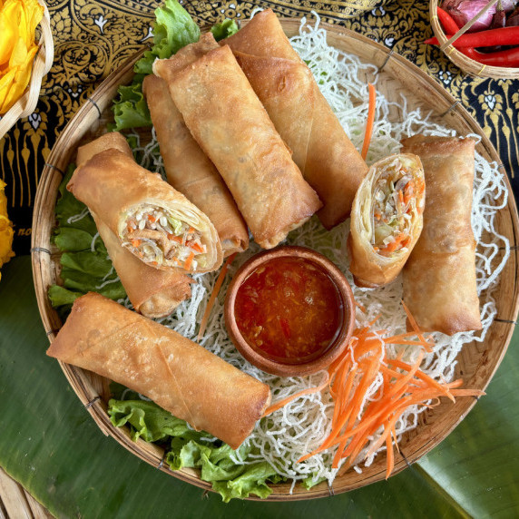 Thai egg rolls with dipping sauce.